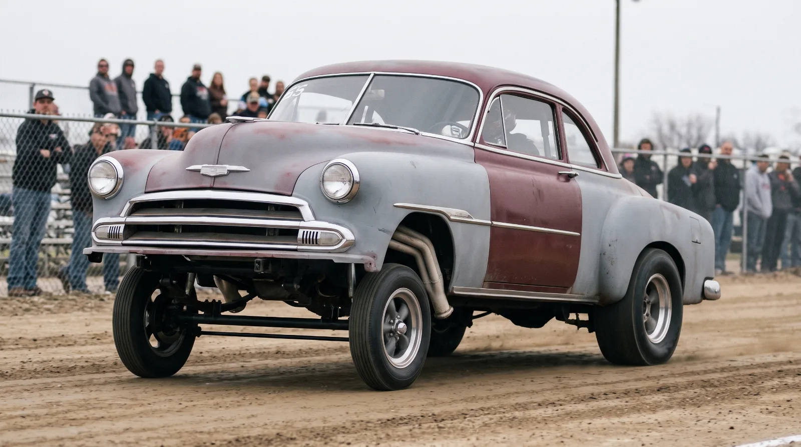 Nose high 1951 Chevrolet gasser on a straight front axle with rear slicks