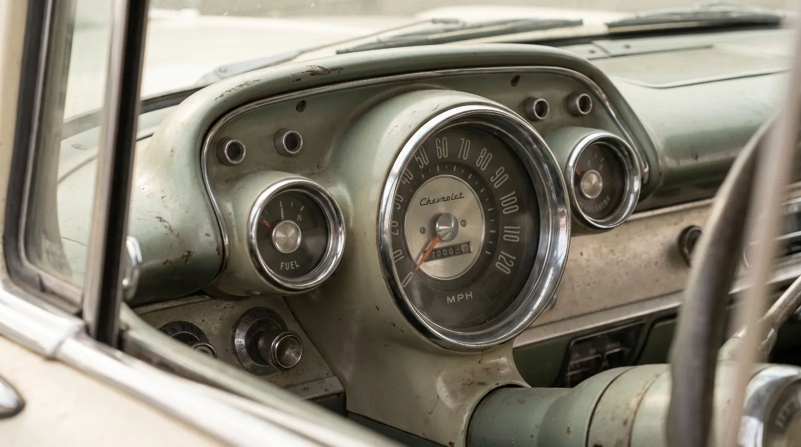 Instrument cluster of an early 1950s Chevrolet showing the fuel, temperature, oil pressure and ammeter gauges