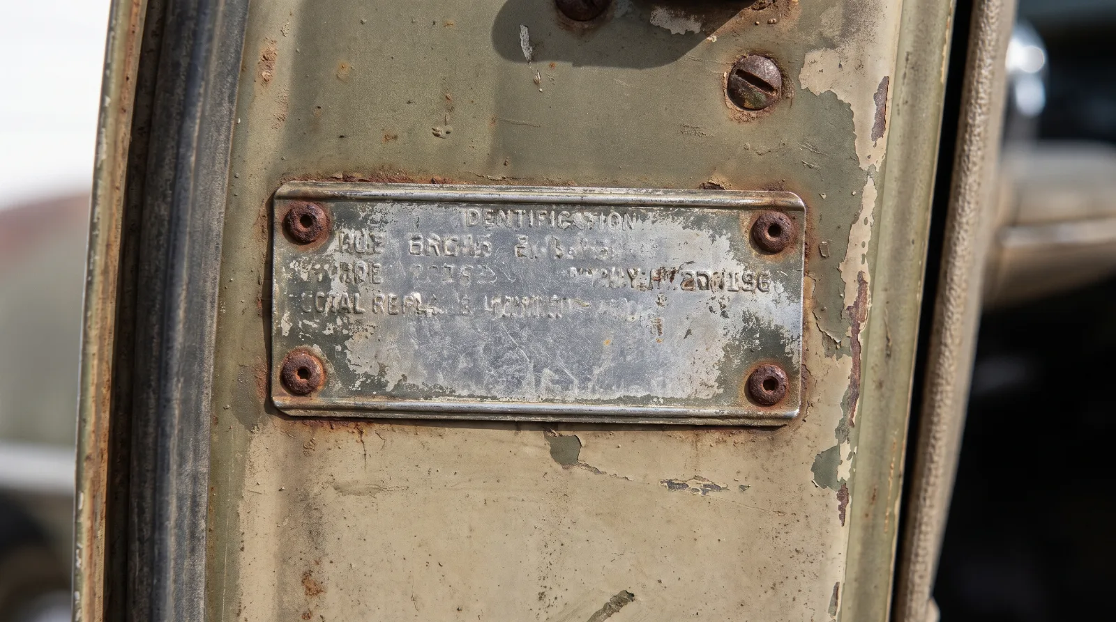 Stamped serial number plate on the driver's door pillar of a 1951 Chevrolet